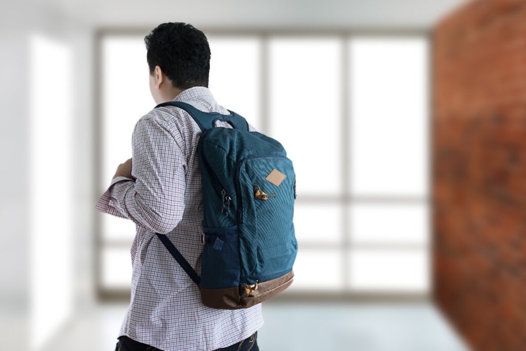 Happy  Student with backpack go to scholl